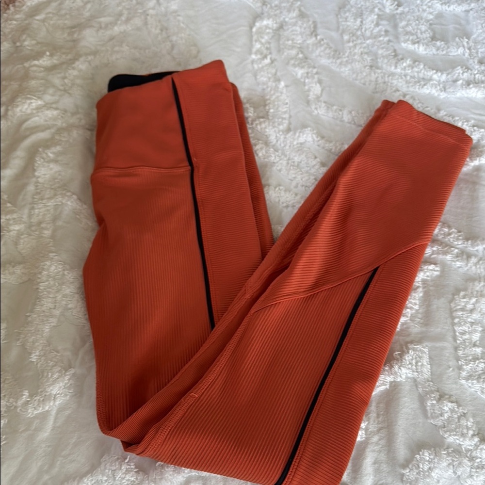 Orange Leggings with Black Stripe Zyia Light n tight ribbed leggings.